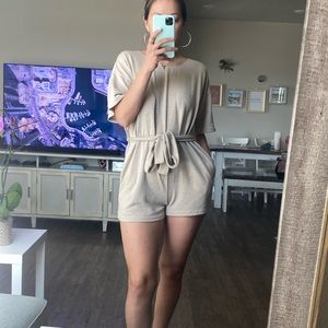 Romper with pockets cream color . Tie knot  front